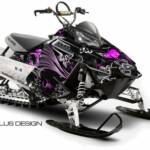 Preview of the Perennial sled graphic for the Polaris Rush/PRO RMK chassis, in pink shown with optional tank pieces.